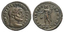 Diocletian (284-305). Æ Follis (27mm, 8.83g, 6h), Ticinum, c. 296-7. Laureate head r. R/ Genius, naked but for cloak and wearing mural crown, holding ...