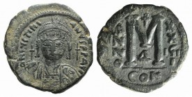Justinian I (527-565). Æ 40 Nummi (31mm, 17.50g, 6h). Constantinople, year 29 (555/6). Helmeted and cuirassed bust facing, holding globus cruciger and...
