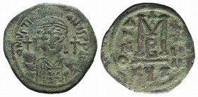 Justinian I (527-565). Æ 40 Nummi (35mm, 17.24g, 6h) Cyzicus, year 24 (550/1). Diademed, helmeted and cuirassed bust facing, holding globus cruciger; ...