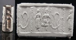 Mésopotamie - Sceau cylindre en pierre noire - 2500 / 2000 av. J-C.
Sceau cylindre en pierre noire orné d'une scène représentant deux personnages ou ...