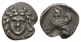 Greek
CILICIA. Uncertain, but perhaps Mallos. Circa 4th century B. Obol 0.7gr. 10.6mm
Facing gorgoneion, wearing triple-pendant earrings. Rev. Sphin...