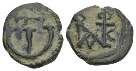 Byzantine 
Justin II Æ 5 Nummi. Antioch, AD 569-578. 1.7gr. 14.3mm
Monogram / Large Є; cross to right. MIBE 65a; DOC 186; Sear 386.