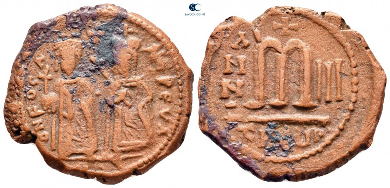 Phocas, with Leontia AD 602-610. Theoupolis (Antioch)
Follis or 40 Nummi Æ

2...