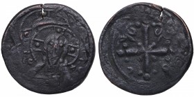 1078-1081 d.C. Constantinopla. Cu. IC-XC a izquierda y derecha del busto nimbate de Cristo mirando, levantando la mano derecha y sosteniendo el pergam...