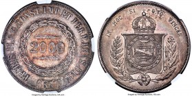 Pedro II 2000 Reis 1867 AU55 NGC, Rio de Janeiro mint, KM466, LMB-626a. Inclined/rotated reverse variety. Dressed in a balanced steel tone carrying to...