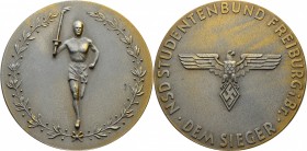 Deutsche Münzen und Medaillen ab 1871
Drittes Reich. . 
Prämienmedaille aus Kriegsmetall o.J. des NSD Studentenbundes Freiburg -"Dem Sieger". Fackel...