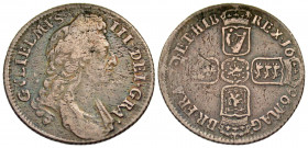 England. William III. 1694-1702. AR shilling (25.6 mm, 5.84 g, 12 h). 1696. First laureate and draped bust right / Four crowned shields cruciform. SBS...