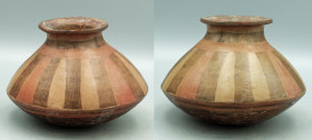 A lovely Nari?o olla from Colombia, ca. 1000 - 1500 A.D. This finely made vessel is 6? in diameter and is decorated with vertical stripes in an altern...