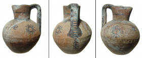 A Cypriot bichrome ware juglet, Cypro-Archaic I, ca. 750 - 600 B.C. the rounded body topped by a trefoil mouth and single handle. The vessel is adorne...
