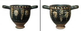 A Greek black-glazed Skyphos, South Italy, ca. 4th Century B.C. with a lovely vine and tendril pattern painted in either side. 3 7/8 x 6 in. (9.8 x 15...