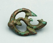 A lovely bronze Roman-Celtic trumpet fibula, ca. 150 - 250 A.D. It is 1-1/2? in diameter and has an intricate design. Lovely patina.