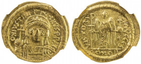 BYZANTINE EMPIRE: Justinian I, 527-565, AV solidus (4.50g), Constantinople, S-140, helmeted and cuirassed bust, holding globus cruciger & shield // an...