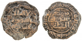 UMAYYAD: AE fals (1.22g), al-Daybul, AH117, A-199D, citing the kalima divided as usual on Umayyad copper coins, with the reverse marginal legend bism ...