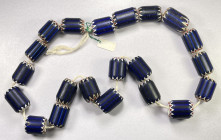 AFRICA: trade bead necklace, string of African chevron beads, the classic 4-layer "rosetta" beads, with 21 large blue, white and red beads ranging fro...