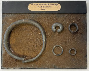 INDONESIA: JAVA: brass ornament set, consisting of 1 bronze bracelet & 4 earrings, ca. 14th-16th century, secured on display plaque, lot of 5 items, V...