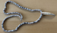 MICRONESIA: gau shell money, 77cm, shell necklace from Yap Island, 30" long string with whales tooth, graduated beads from 1/4" to 5/8" in diameter, a...