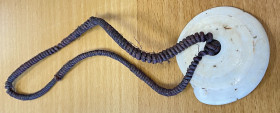 PAPUA NEW GUINEA: conus shell necklace, 62mm plus length of cord, conus shell whorl attached to native fiber, EF, ex Charles Opitz Collection. 
Estim...