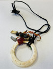 PAPUA NEW GUINEA: doga shell necklace (43.66g), Opitz p.133, consisting of a large shell ring (ca. 66mm in diameter), attached to strings of coral bea...