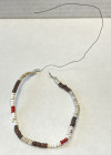 PAPUA NEW GUINEA: shell money (3.57g), ca. 195mm, consisting of numerous small colorful shell and coral discs on a wire, VF, ex Charles Opitz Collecti...