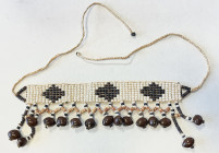 SOLOMON ISLANDS: shell beads (61.27g), Opitz p.301 (plate example), 220 x 25mm, consisting of a patterned braided headband, attached to 15 brown shell...