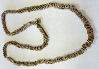 SOLOMON ISLANDS: shell money, 85cm, double-row shell discs braided together in a circle, VF, ex Charles Opitz Collection. 
Estimate: USD 100 - 200