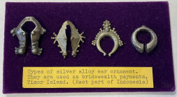 TIMOR: AR ornament set, Opitz p.136 (plate example), consisting of 4 silver earrings from Timor Island, once used as bridewealth payment, secured on p...