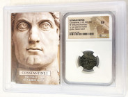 ROMAN EMPIRE: Constantine I, 307-337 AD, AE reduced nummus, sun-god Sol holing globe, raising his left hand, holder housed in display case, NGC graded...