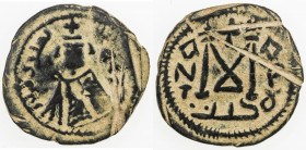 ARAB-BYZANTINE: Imperial Bust, ca. 680-692, AE fals (6.39g), Tardus (Antardos), A-3525, mint name in Arabic left, Greek KALON right // capital M, flan...