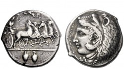 Greek Coins 
 Camarina 
 Tetradrachm signed by Exakestidas circa 410, AR 16.82 g. Fast quadriga driven r. by helmeted Athena, holding kentron and re...