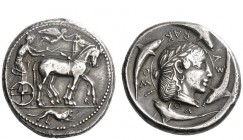 Greek Coins 
 Syracuse 
 Tetradrachm of the Demareteion series circa 465, AR 17.38 g. Slow quadriga driven r. by charioteer, wearing chiton , holdin...