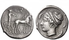 Greek Coins 
 Syracuse 
 Tetradrachm circa 420-415, AR 17.27 g. Slow quadriga driven r. by charioteer, holding reins and kentron ; in exergue, grass...