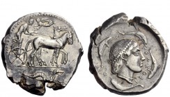 Greek Coins 
 Syracuse 
 Tetradrachm circa 460-440, AR 17.34 g. Slow quadriga driven l. by charioteer crowned by Nike; in exergue, sea monster r. Re...