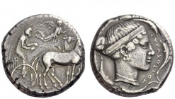 Greek Coins 
 Syracuse 
 Tetradrachm circa 430-420, AR 17.25 g. Slow quadriga driven r. by charioteer holding reins and kentron. Nike, above, flying...