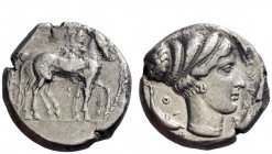 Greek Coins 
 Syracuse 
 Tetradrachm circa 430-420, AR 16.86 g. Slow quadriga driven r. by charioteer, holding reins and kentron ; above, Nike flyin...
