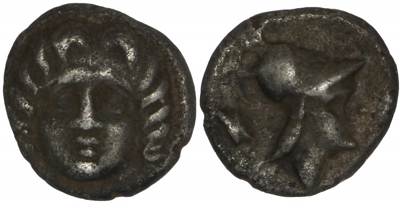 Pisidia, Selge. AR Obol. Circa 350-300 BC.

Obv: Facing gorgoneion
Rev: Helme...