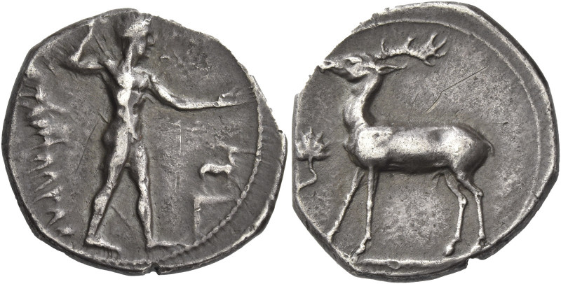 Greek Coins. Caulonia. 
Nomos circa 420-410, AR 7.58 g. Apollo walking r., hold...
