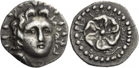 Greek Coins. Rhodes. 
Drachm circa 40 BC-25 AD, AR 4.03 g. Head of Helios facing slightly r. Rev. P – O Rose seen from above; around, APIΣTOMAXOΣ and...