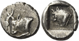Greek Coins. Uncertain mints in Caria. 
Diobol circa 5th century BC, AR 2.20 g. Confronted foreparts of two bulls. Rev. Bull's head l. with dotted ne...