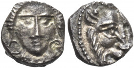 Greek Coins. Samaria. 
Ma‘eh or obol mid-fourth century BC, AR 0.72 g. Female head facing, with large earrings. Rev. Lion’s head facing. Meshorer-Qed...