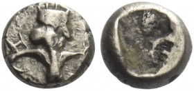 Greek Coins. The Achamaenid Kings of Persia, Time of Darius I, circa 522 – 486. 
1/16 (?) siglos, Sardis 510-486, AR 0.26 g. Half-figure of the Great...