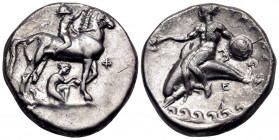 CALABRIA. Tarentum. Circa 340-335 BC. Nomos (Silver, 21 mm, 7.55 g, 12 h). Nude jockey riding horse standing to right, crowning his horse with a wreat...