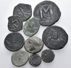 Circa 5th -10th century. (Bronze, 75.00 g). A lot of Eleven (11) coins, mostly byzantine folles and fractions. Fine or better. Lot sold as is, no retu...