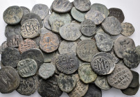 BYZANTINE. Circa 5th - 12th century. (Bronze, 770.00 g). A lot of Eighty-five (85) Byzantine bronze coins, mostly Folles. Patinated. An attractive lot...
