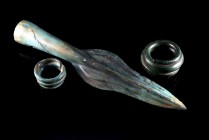 Late Iron Age, Bronze spear-head and two spiral rings. 1200-800 BC. Dark green patina, scratches and corrosions on spear-head, otherwise intact.