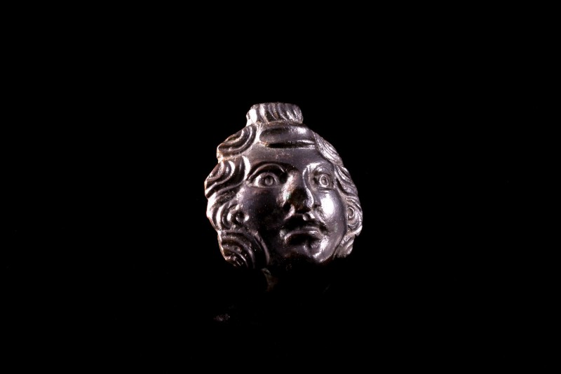 Roman Bronze Applique with Youth Head, c. 1st-3rd century AD (2.3cm). Dark green...