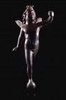 Roman Bronze Figure of Flying Eros, standing on globe and extending his left hand, c. 2nd - 3rd century AD (15cm). Base and object held in left hand m...
