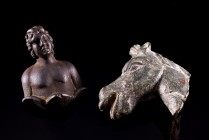 Lot of 2 Roman bronzes. c. 2nd-3rd century AD. The first is a head of horse (4.5cm) while the second is an applique with a male bust facing. (4cm). In...