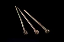 Lot of 3 Roman Bronze Needles. c. 1st-3rd century AD. Different lenghts (9.4cm, 9.8cm, 10.1cm). All intact and topped with nice and detail finials.