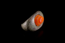 Roman Bronze Finger Ring with red, white and orange layered Agate, c. 2nd-3rd century AD (3cm). Traces of gilt, slightly bent.