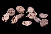 Lot of 11 Roman Lead Seals, c. 4th-5th century AD (16-20mm), including busts, standing figures and inscription in Latin and Greek.